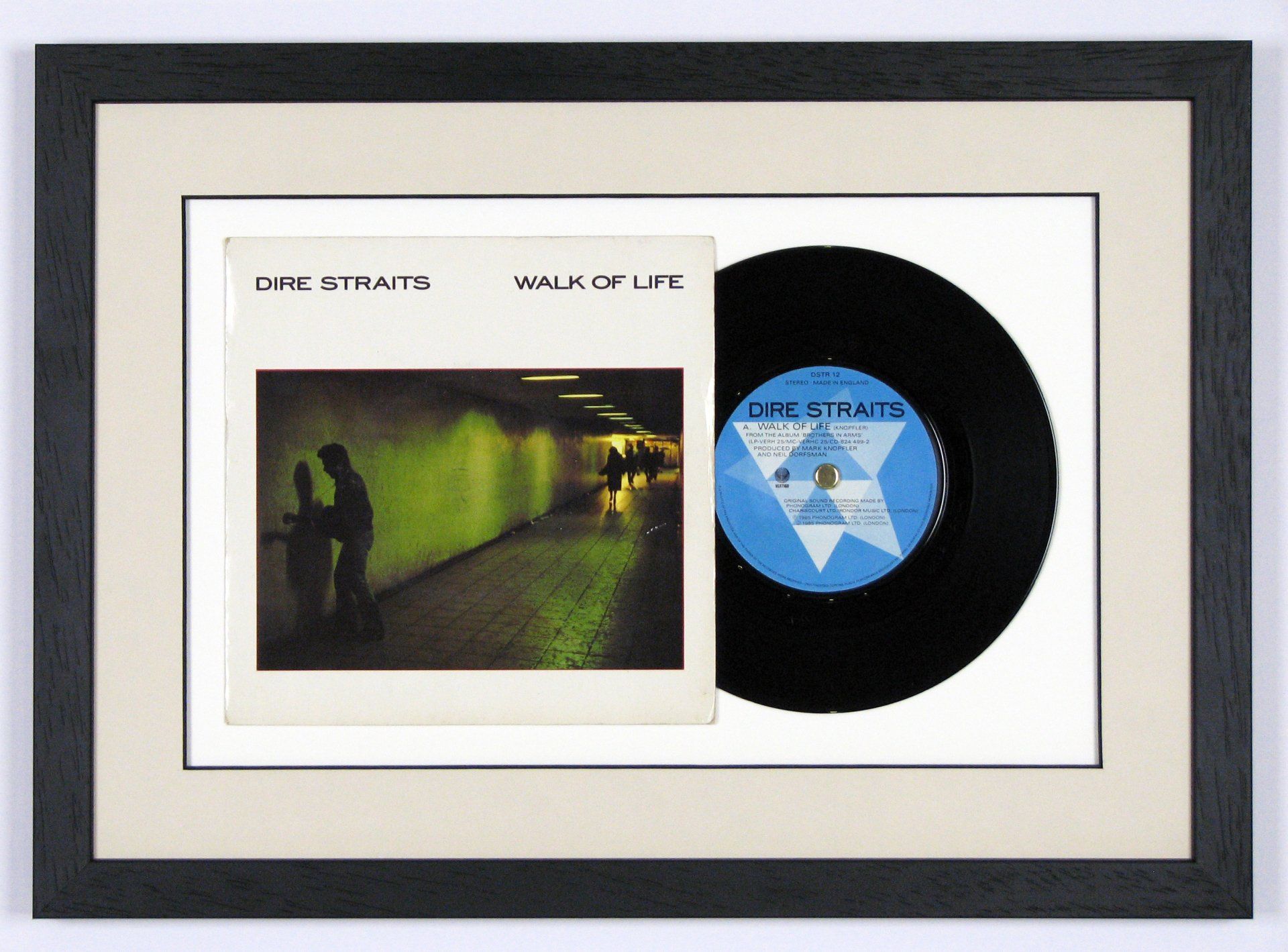 Memorabilia float-mounted in a deep box frame under glass.